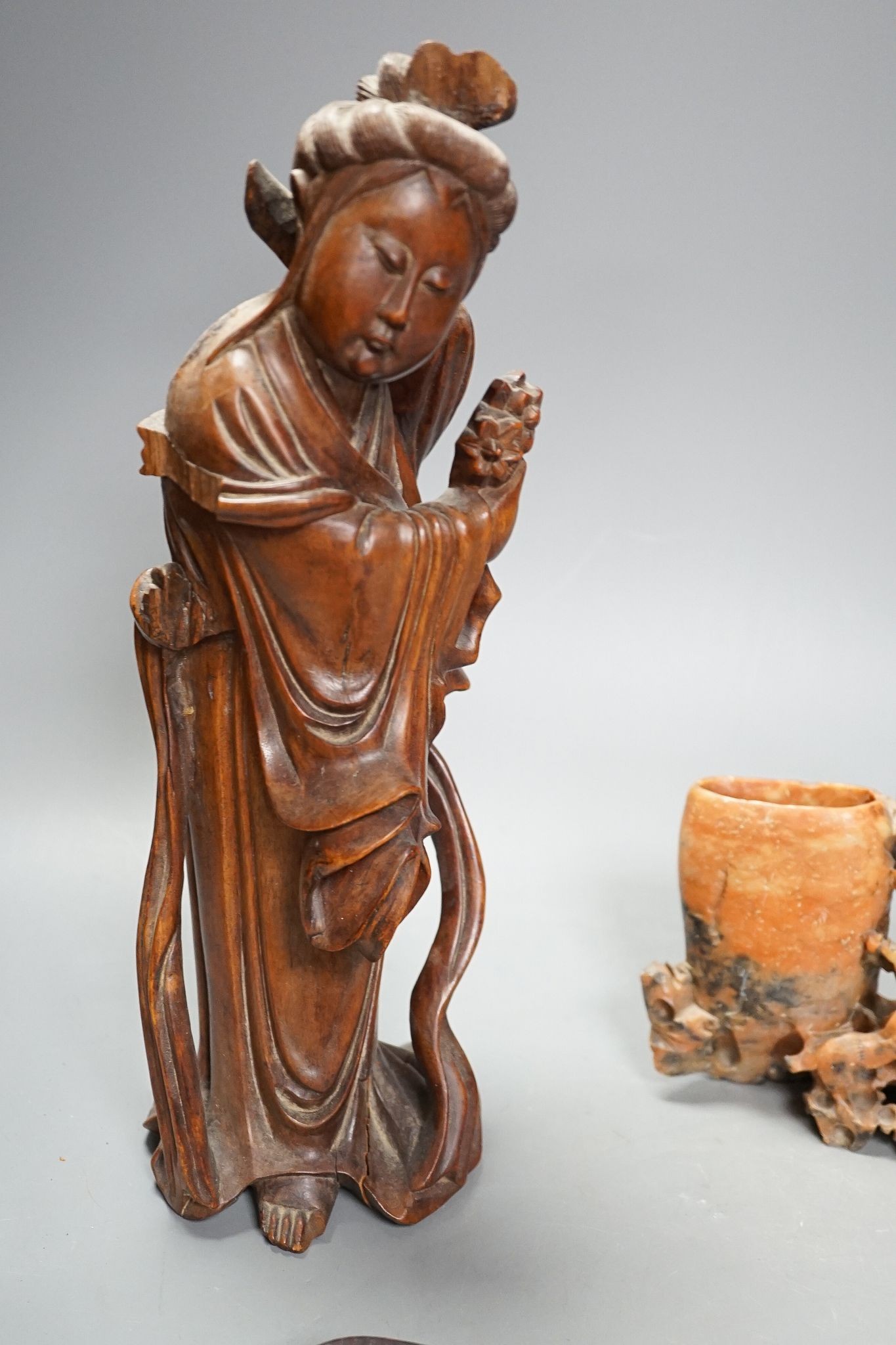 A Chinese carving of a deity, 32cm, a prunus jar, miniature vase, etc.